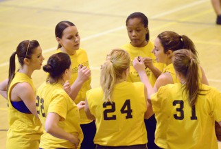 women huddle in Basketball game