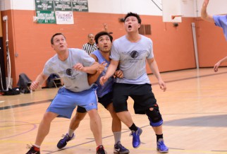 Players fight for rebound in Nyc basketball league game