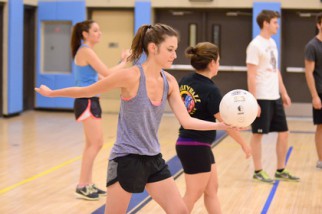 Young woman preparing to serve volleyball