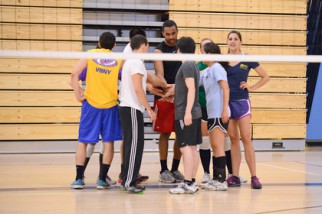 Volleyball team huddles in Nyc coed volleyball league game