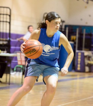 Women’s woman dribbling basketball