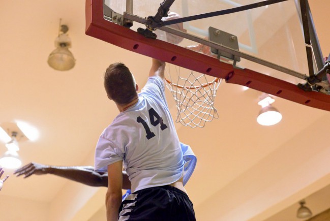 player dunks the ball