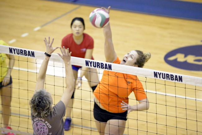 Player spikes the volleyball